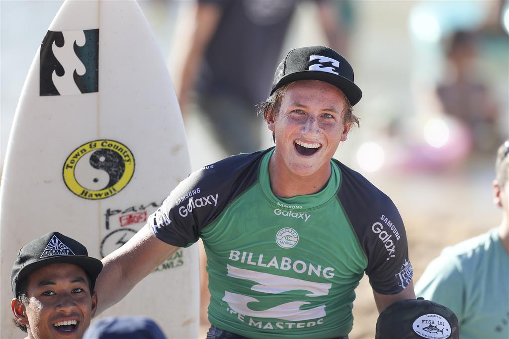 Sixteen year old Finn McGill of Hawaii (pictured) is chaired up the beach after winning the final of the Men’s Pipe Invitational at Pipeline, Oahu, Hawaii on Monday December 12, 2016. PHOTO: © WSL / Cestari